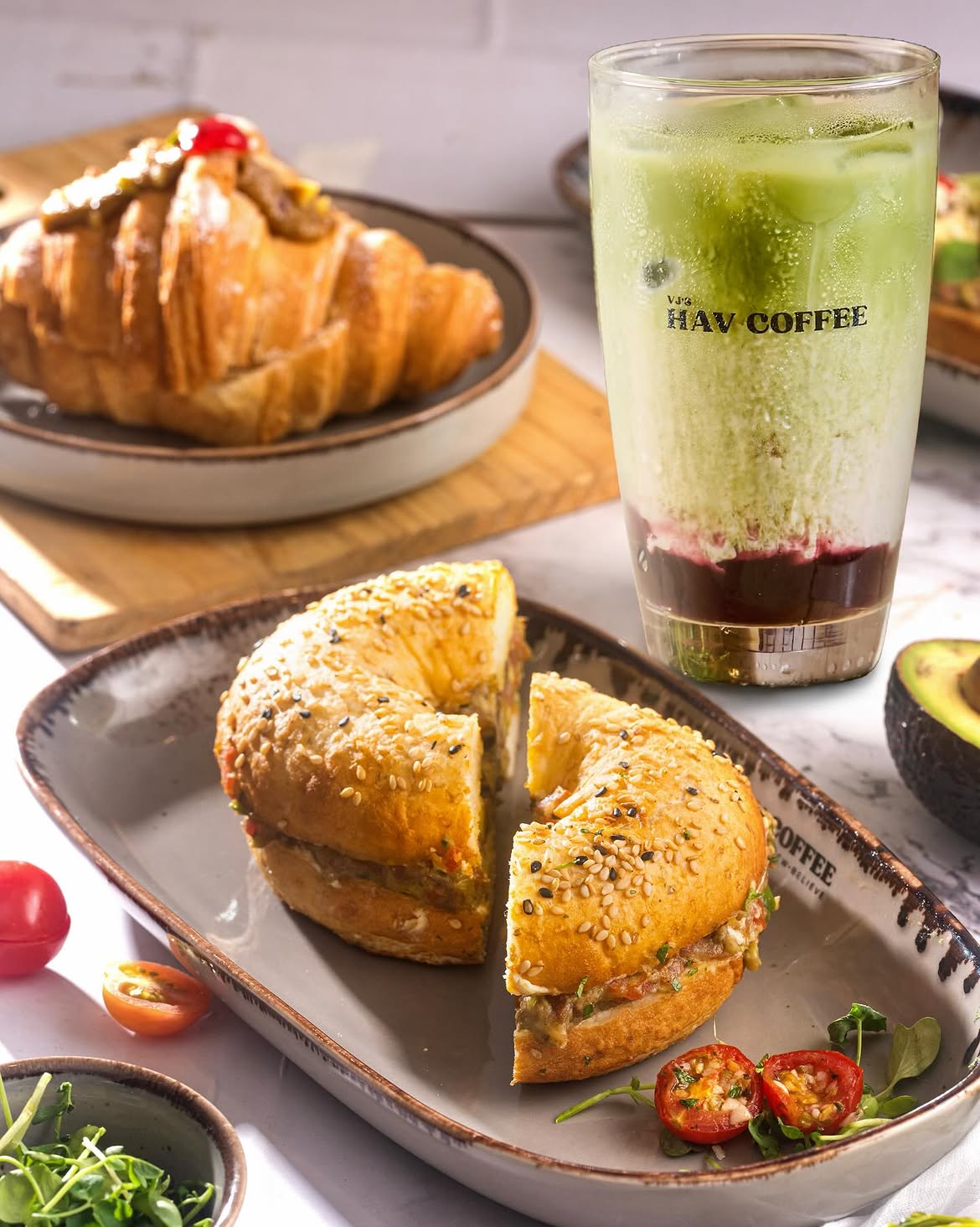 Some tables know exactly what’s coming.Bagel Sandwich, Berry Matcha Latte, Raspberry Pistachio C